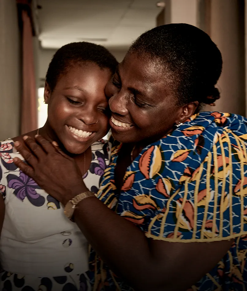 Olivia Aka lives with type 1 diabetes in the Ivory Coast and is supported by the CDiC programme. Pictured here with her grandmother. (photo)
